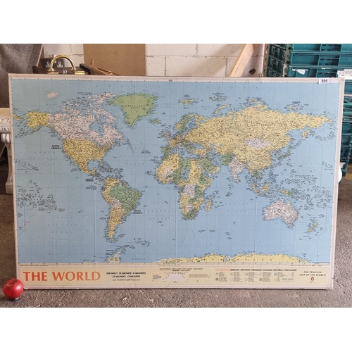 594 - A wall mounting map of the world, a heavy example mounted on plywood backing. Devised by Michael Mid... 