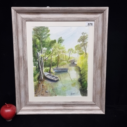 70 - An original watercolour and pencil on paper painting of rowboats moored at a quiet river in a lush f... 