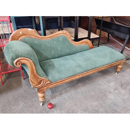 730 - A charming Victorian chaise longue, solid oak frame with carved detail, upholstered in green fabric ... 