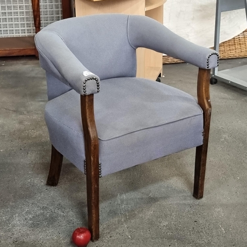 731 - A lovely open arm chair with wooden legs, upholstered in a chic grey fabric with stud detailing.