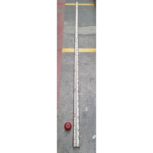 678 - A really unusual example of a large, extendable measuring stick with brass fittings and measurements... 