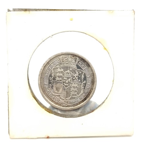 11 - A George IV silver half crown, circa 1823. Together with a 1819 George III silver shilling. Both in ... 