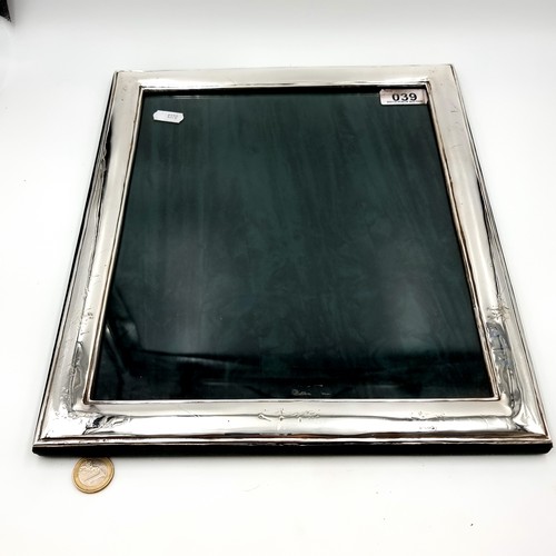 39 - A super fine example of a very large Irish silver photo frame, by C. F Limited. Internal dimensions:... 