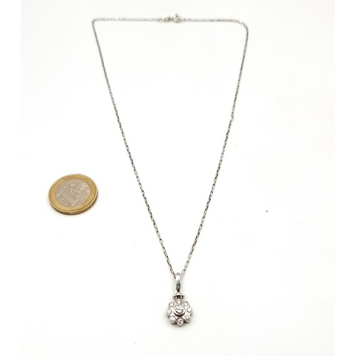 50 - Star Lot: A fabulous 18ct white gold diamond  flower drop pendant, together with an attractive white... 