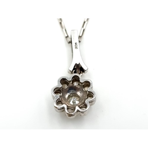 50 - Star Lot: A fabulous 18ct white gold diamond  flower drop pendant, together with an attractive white... 