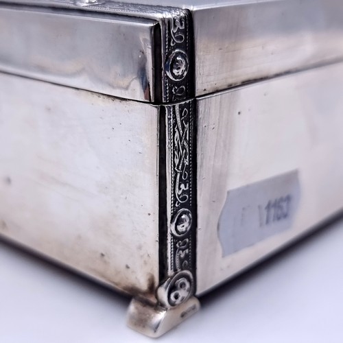 60 - An excellent example of a sterling silver cigarette box, with cedar wood lining and featuring attrac... 
