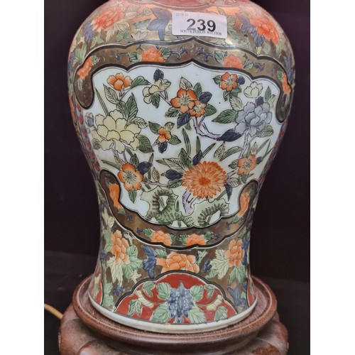 239 - A splendid, very impressive large table lamp with highly ornate Chinese motif porcelain base on a wo... 