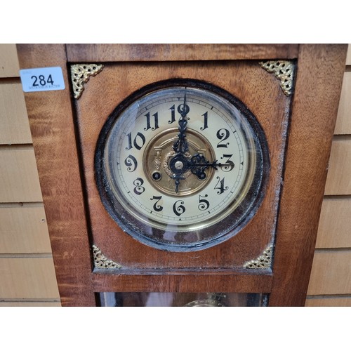 284 - A very impressive, antique  31 day chiming wall clock. With enamel dial, brass bezel and a highly in... 