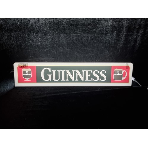 296 - A light-up advertising sign for Guinness with vintage aesthetic and three pin plug.