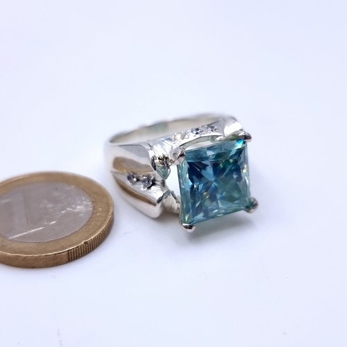 700 - An attractive huge Topaz and Diamond sterling silver ring. Size: V.  beautiful stone and a large hea... 