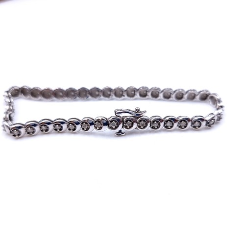 690 - Star Lot A beautiful 9k white gold Diamond Tennis bracelet. With 38 bright sparkly matching brillian... 