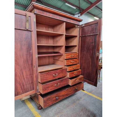 389 - Star Lot: A truly remarkable antique double wardrobe of substantial proportions. Crafted from solid ... 