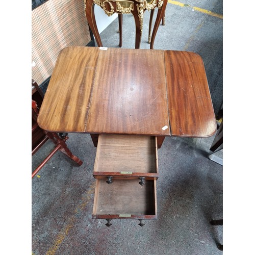 392 - Star Lot : A lovely, neatly proportioned drop leaf table on castors, with four drawers and turned le... 