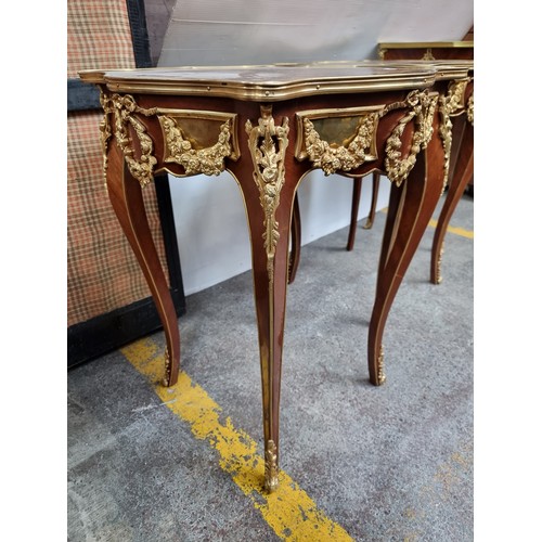 395 - Star Lot : A superb Louis XV style side table. With a pie crust top and sleek sabre legs, this piece... 