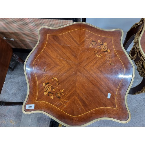 395 - Star Lot : A superb Louis XV style side table. With a pie crust top and sleek sabre legs, this piece... 