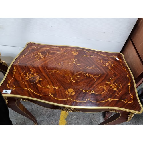 396 - Star Lot L: A highly elegant Louis XV style console table with rich floral marquetry to top and exte... 