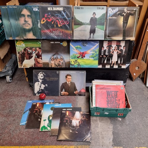 681 - A collection of 36 vinyl records including examples by Elton John, ABBA, Blondie, Elton John etc.