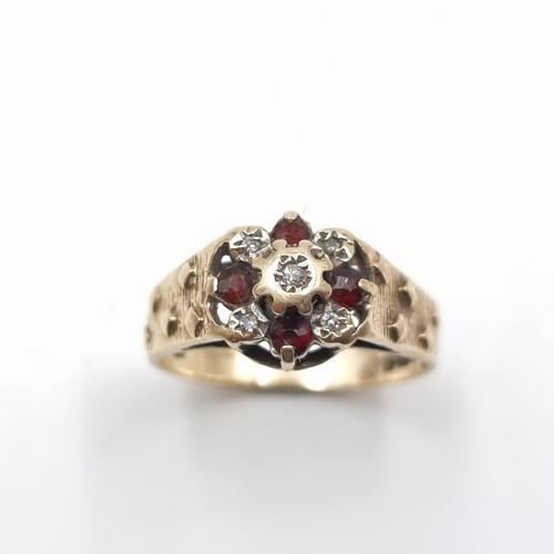 530 - A fine example of an antique 9 carat Gold Ruby and Diamond ring, with wide set shoulders. Ring size:... 