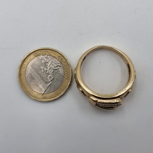 505 - Star Lot: A fine example of a Gents gold buckle ring, set with Diamond surround. Set in 9ct Gold and... 