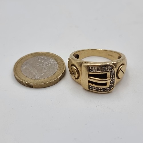 505 - Star Lot: A fine example of a Gents gold buckle ring, set with Diamond surround. Set in 9ct Gold and... 