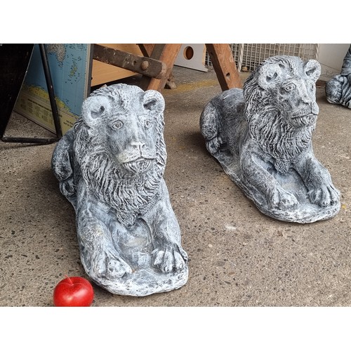 Two fabulous heavy reconstituted stone sculptures of regal lions. Would look great at an entrance.