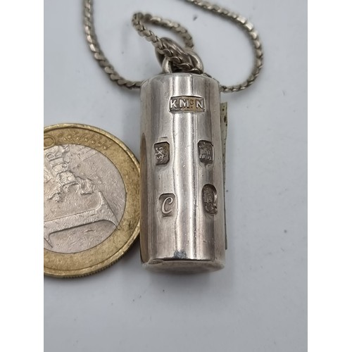 502 - A sterling silver heavy  Ingot and chain. Hallmarked Glasgow, circa 1977. Total weight: 37.5 grams.