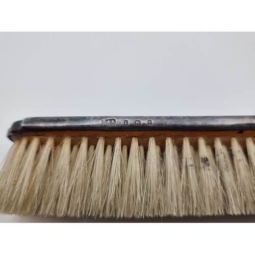 501 - A pair of sterling silver vintage inlayed Tortoise shell vanity brushes. Hallmarked London, with a m... 