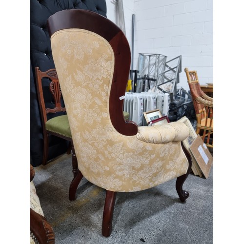 470 - A beautiful Victorian style armchair with lovely curves throughout the carved wooden frame. Upholste... 