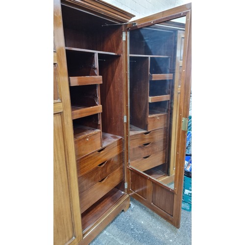 563 - A wonderful example of an early twentieth century Miller & Beatty Dublin golden oak wardrobe, with s... 