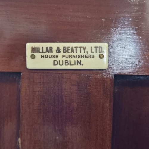 563 - A wonderful example of an early twentieth century Miller & Beatty Dublin golden oak wardrobe, with s... 