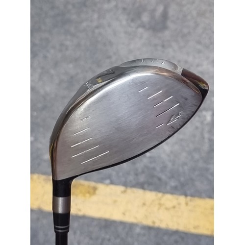 317 - A tailor made titanium R7 Draw golf driver. Including headcover.