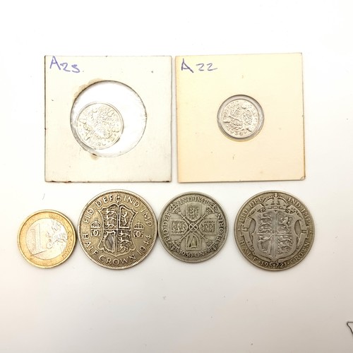 13 - A collection of five coins, consisting of four George V examples, a half crown, a Florin, a six and ... 