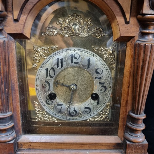 123 - A gorgeous antique 8 day Hamburg-American bracket clock, with polished brass face with ornate motif ... 