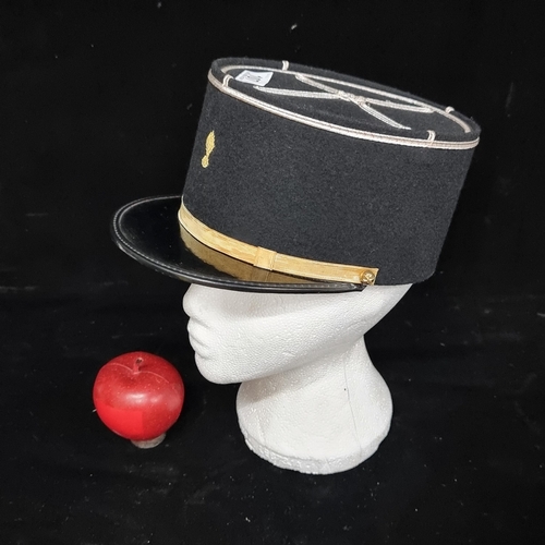 107 - A traditional French military police kepi, with gilt rope work. In lovely condition.