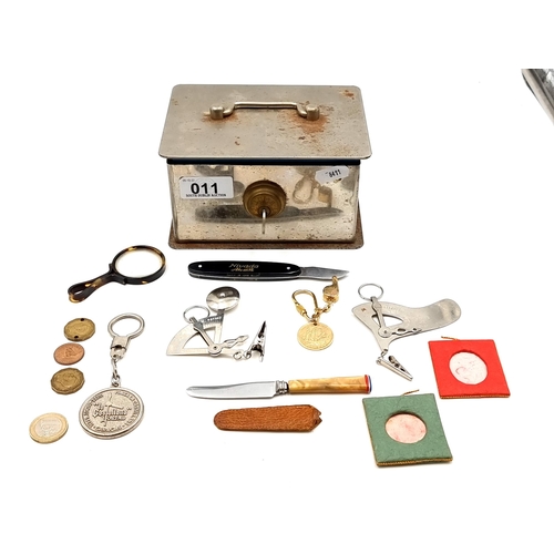 11 - An interesting collection of items, Including 2 pocket scales, two pocket knives, a pocket magnifyin... 