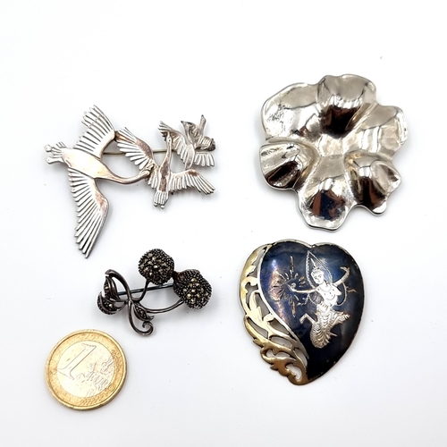 14 - A collection of four pretty Sterling silver brooches, each set with various gemstones and engravings... 