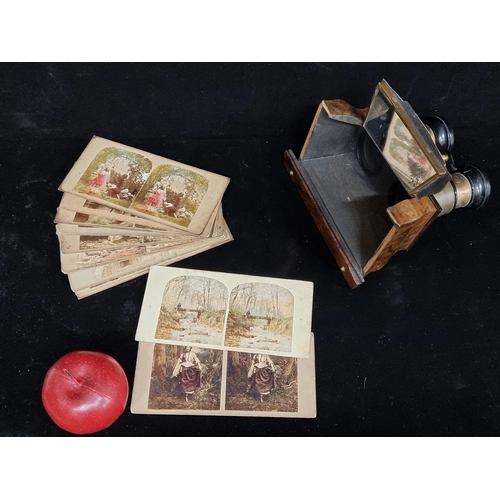 249 - A fantastic antique 19th century  stereoviewer lens along with mirror, with sixteen cards of differe... 