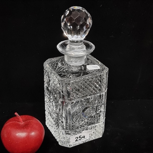 254 - A lovely Waterford Crystal very heavy crystal decanter with a beautiful star pattern to each side. A... 