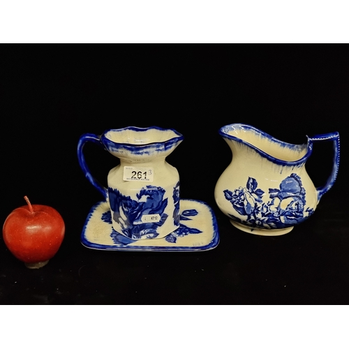 261 - Three antique Staffordshire Ironstone England items, including two jugs and a pin tray, a floral blu... 