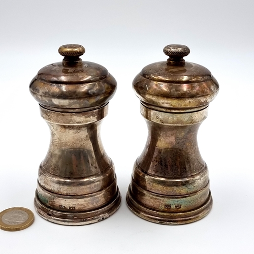 28 - A fine pair of silver plated condiments, marked S.W. with a crown insignia. Makers state 