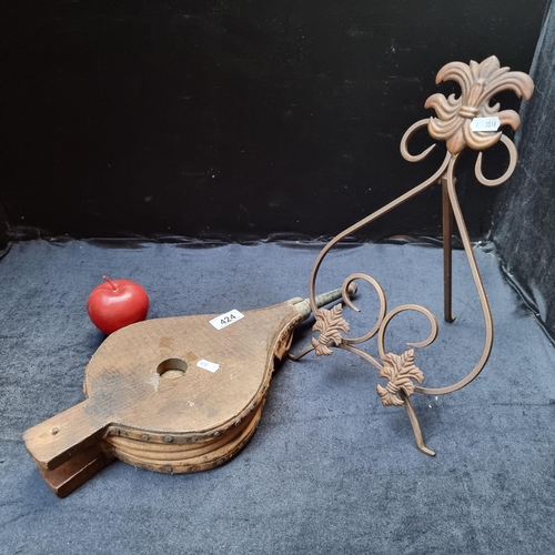 424 - Two interesting items including an antique fire bellows with a freestanding, cast metal, menu displa... 