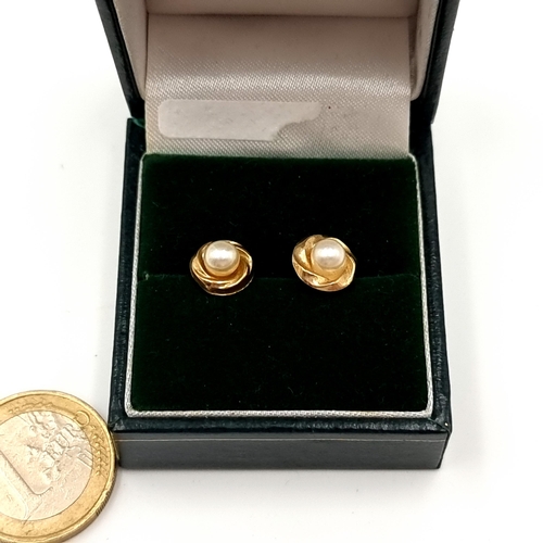46 - A pretty pair of 9ct Gold Pearl wreath surround stud earrings, accompanied by 9ct Gold butterfly bac... 