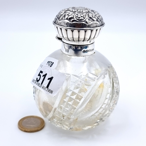 511 - A beautiful antique sterling silver topped perfume bottle. This example features a beautiful hob nai... 