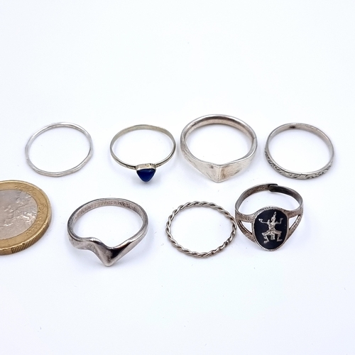 549 - A collection of seven designer sterling silver rings. Sizes:  L, N and P.