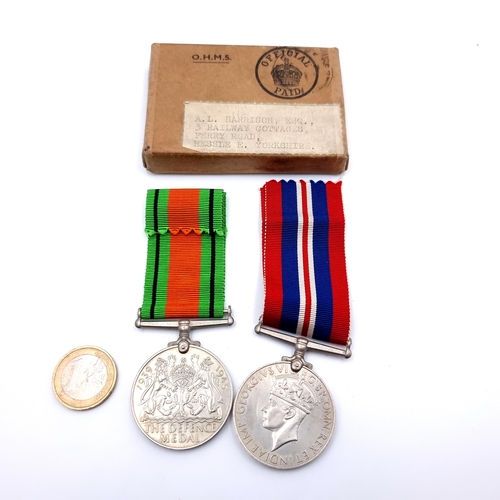 552 - Two World War II medals, comprising of a Defense Medal of 1939 and 1945 medals. With original ribbon... 