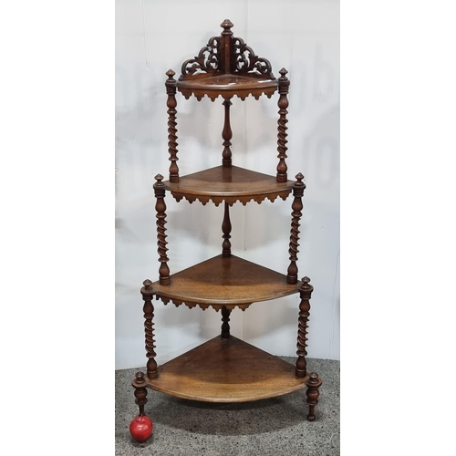 566 - A magnificent example of a Victorian walnut What-Not. With turned barley twist stems, pierced foliat... 