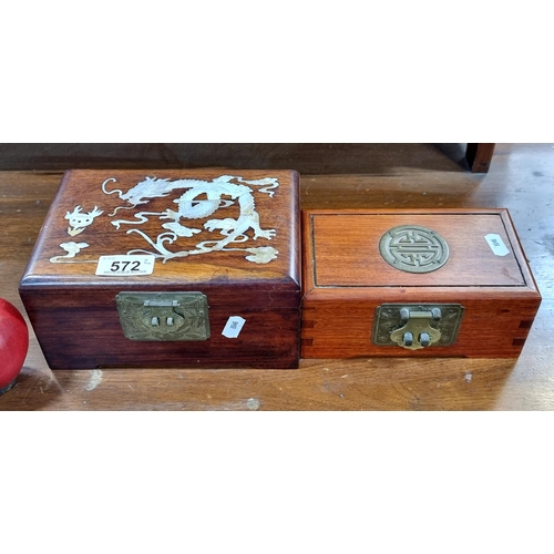 572 - Two pretty wooden jewellery boxes of Chinese origin, including a larger example with mother of pearl... 