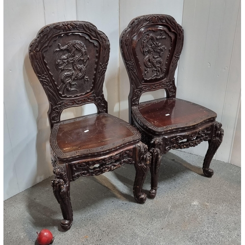 665 - Star lot : A striking pair of late 19th century Chinese carved ebonised rosewood and black lacquer p... 