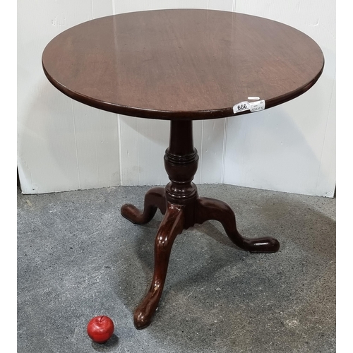 666 - Star Lot : A fantastic George III (1760-1820) mahogany circular tea table on a turned wood centre pi... 