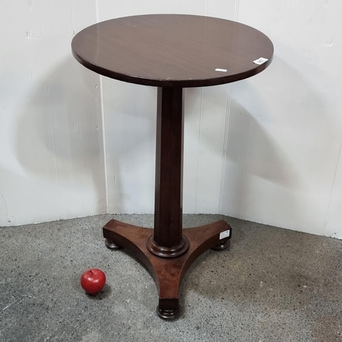 667 - Star Lot : A lovely early Victorian mahogany circular wine table on a triangular platform base and b... 